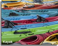 Colourful kayaks on the beach