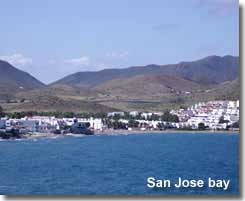 San Jose bay with backdrop of the village and mountains
